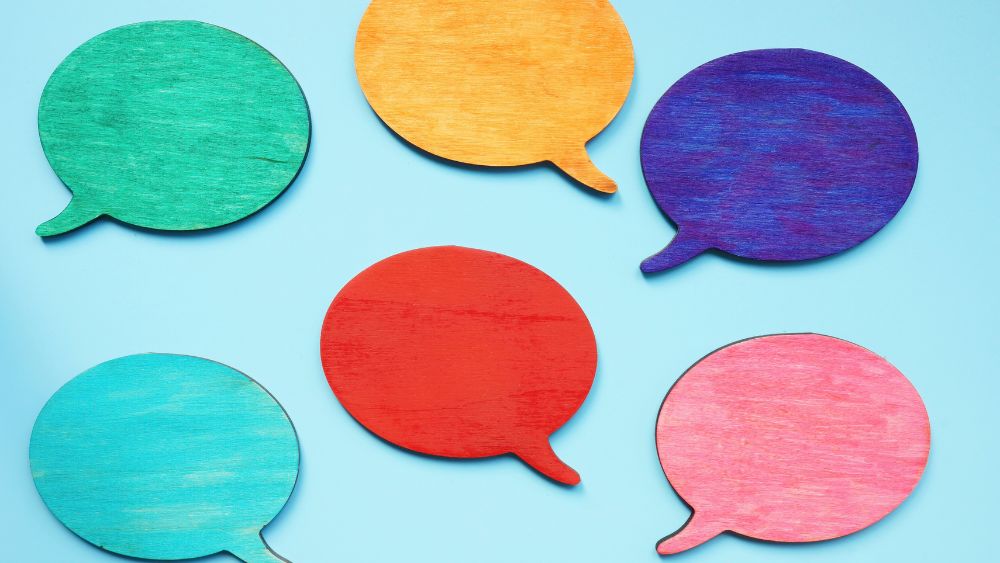 Multicoloured speech bubbles, representing sharing diverse points of view